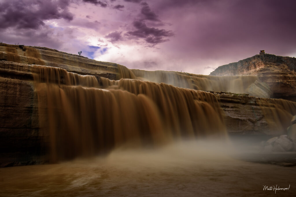 A large chocolate milk colored waterfall